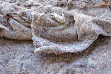 Old burlap and batting. Protruding threads. Conceptual background for design.