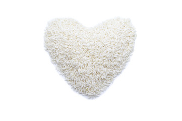 Rice grains in heart shape isolated on white background.