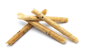 Tong Muan (crispy egg roll mix with sesame), Thai dessert Roll wafer, A traditional dessert in Thailand   isolated on white background.