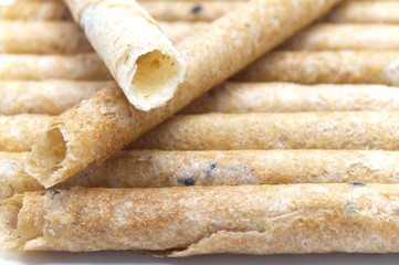 Tong Muan (crispy egg roll mix with sesame), Thai dessert Roll wafer, A traditional dessert in Thailand close-up full frame background.