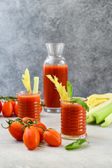 Healthy soft drink  with tomatoes and celery. vitamin smoothies tomato juice, vegetable juice healthy food, selective focus image