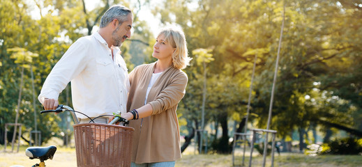 Caucasian elderly couples come to relax in the park during the summer. Of long holidays and Picnic. Tourism activities Of retire. Friendship, love and care your health. Health insurance concept