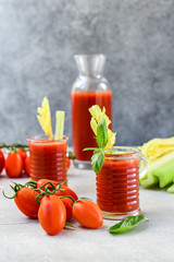Healthy soft drink  with tomatoes and celery. vitamin smoothies tomato juice, vegetable juice healthy food, selective focus image