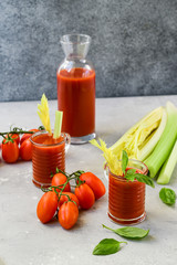 Healthy soft drink  with tomatoes and celery. vitamin smoothies tomato juice, vegetable juice healthy food, selective focus image