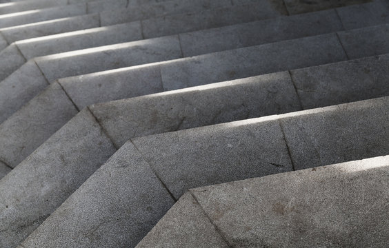 Empty stone stairs with bright sunlight pattern © evannovostro