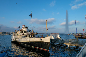 very old steamboat on Lake Geneva in front of the water jet  in Geneva Switzerland