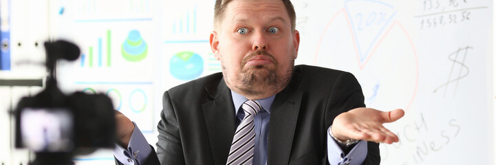 Businessman uncertain blogger online coach screaming intro camera bad news concept
