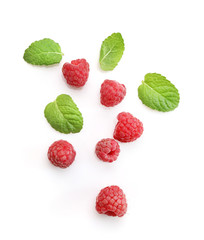 Ripe rasberries and mint isolated on white background. Top view