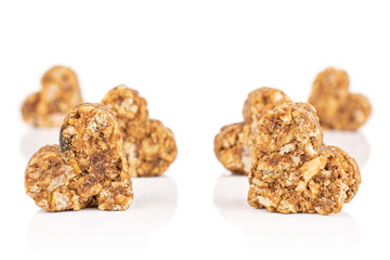 Group of six whole healthy brown cereal heart with cocoa isolated on white background