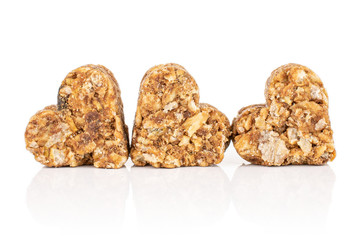 Group of three whole healthy brown cereal heart with cocoa isolated on white background