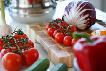Red Tomato Assortment Ingredient Photography. Organic Vegetable on Kitchen Table. Raw Cabbage and Cucumber. Culinary Recipe Blog. Red Tomato and Purple Cabbage on Wooden Board. Vegetarian Lifestyle