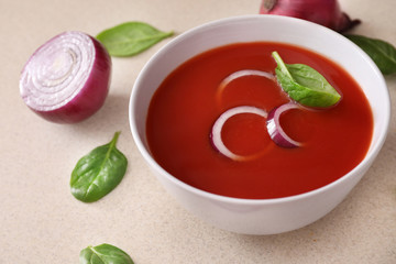 Bowl of tomato soup on kitchen table