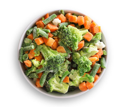 Frozen Vegetables In Bowl Isolated On White. Top View