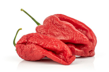 Group of two whole hot chili pepper both red isolated on white background