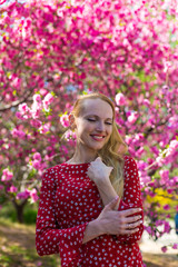 Blonde model in sakura garden 