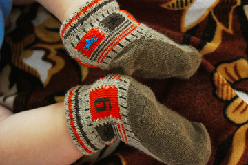 Newborn baby feet close up in colored socks