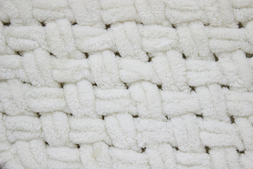 knitted large blanket handmade, super chunky yarn, trendy concept. Close up of knitted blanket, background