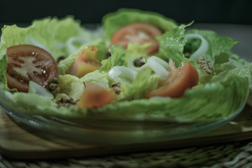 lettuce salad with tomatoes onions nuts bread and more healthy vegetables to eat