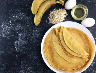 banana and egg pancakes, morning breakfast, diet breakfast, cooking on the black background