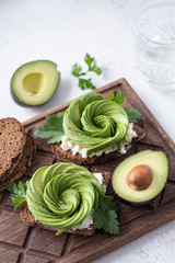 Fresh avocado rose toasts with cream cheese