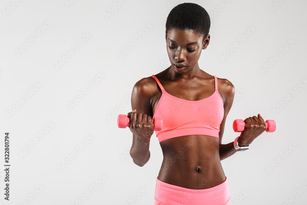 Wall mural Image of african american sportswoman doing exercise with dumbbells