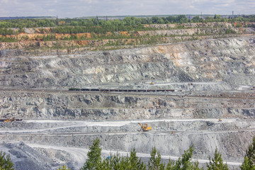 Big quarry abest ore mining at summer day
