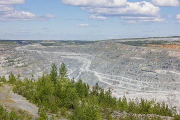 Big quarry abest ore mining at summer day