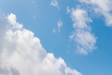 Beautiful white big soft fluffy cloud on a blue sky background