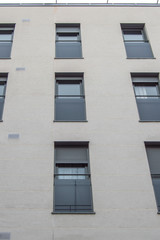 gray facade with vertical elongated windows