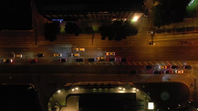 flight over vienna city center night time illumination traffic street aerial topdown panorama 4k austria