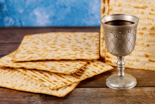 Kiddush cup of wine with matzos bread. Jewish pesah holiday.