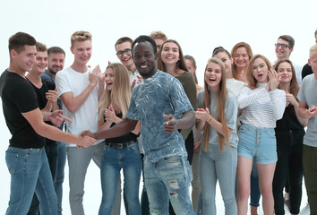 group of young like-minded people standing together applauding.