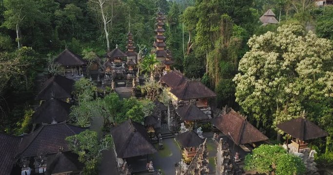 Hinduism tample surrounded by green jungle forest.