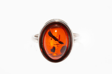 Beautiful silver ring with amber and insect inside isolated on white background