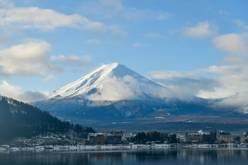 Fototapeta premium The view of Mount Fuji, Japan in the winter with snow covering all over