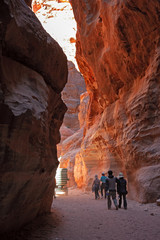 Tourists in the gorge leading to the visit of the archaeological site of Petra in Jordan.