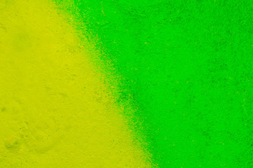 Beautiful bright colorful street art graffiti background. Abstract creative spray drawing fashion colors on the walls of the city. Urban Culture, yellow ,green , sunny, salad , light texture