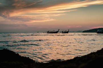 Sunset at sea beach with boat, sea and sunset landscape photography.