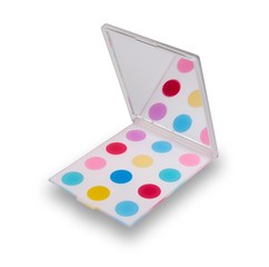 A funcky hand held compact mirror with colourful spots,  isolated on white