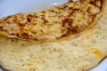 Omelet on a white plate. Wholesome breakfast.