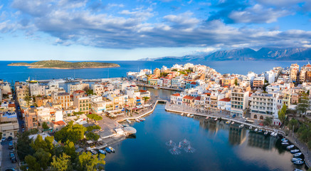 Fototapeta na wymiar Agios Nikolaos, a picturesque coastal town with colorful buildings around the port in the eastern part of the island Crete, Greece