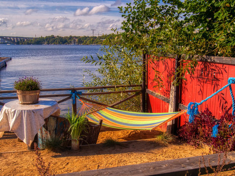 hangmat, sand and table with view of lake