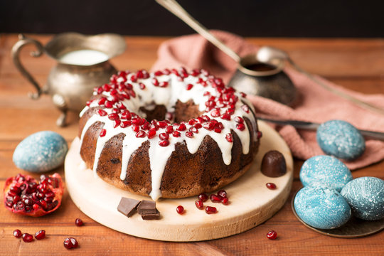 Chocolate cake and easter eggs are painted in cosmic blue. Easter menu.