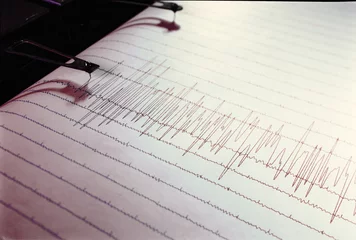 Swinging needle of seismograph at earthquake. © Anna