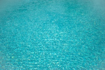 The texture of the aquamarine color of the natural surface of the pool
