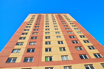 A wall with Windows of a new modern multi storey residential building a House