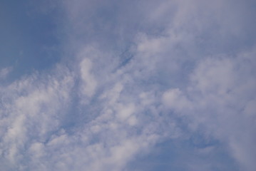 The blue sky and he white and greyish clouds