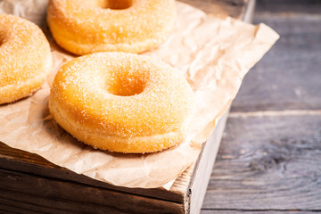 Donut with apple jam on the rustic background. Selective focus.