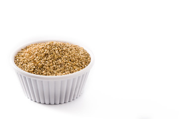 Golden flax seeds in white bow isolated on white background.Copy space