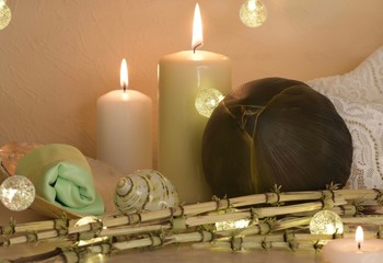 candles with rolled towel, shell and bud